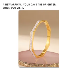 Macro view of gold plated octagonal bracelet with sparkling pavé crystal stones