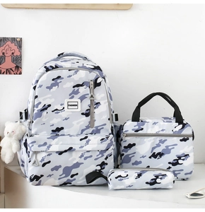 Three-piece set featuring large school backpack, lunch bag, and pencil case in grey camo