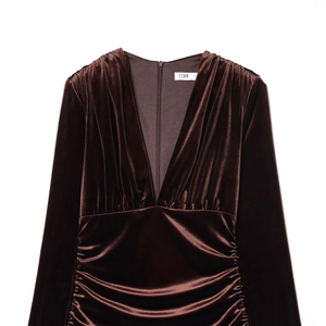 Ruched chocolate brown velvet midi dress featuring long sleeves and a deep V-neckline
