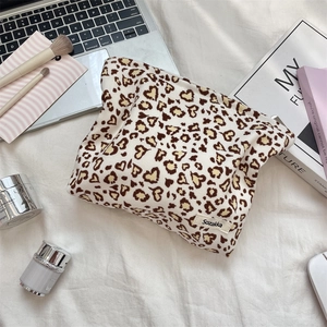Detail of corduroy leopard heart print makeup bag with Sozakka brand woven label