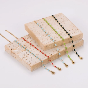 Minimalist stainless steel bracelets with colorful square beads in tiered display