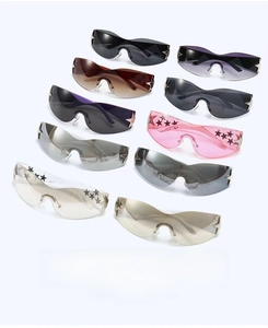 Macro shot of colorful rimless star sunglasses with metallic five-point star accents