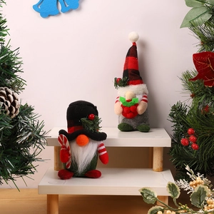 Festive Christmas gnomes on tiered stand with plaid hats, canes and holiday berries