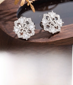 Close-up of vintage iris flower stud earrings with zircon inlay and 0.8x6mm steel post