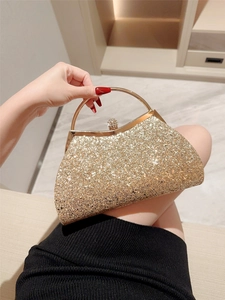 Elegant gold sequin evening clutch bag with sparkling rhinestone crown clasp and metal handle