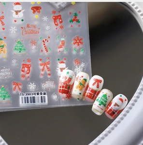 Close-up of TS-3903 Christmas nail stickers with snowmen and gingerbread man designs