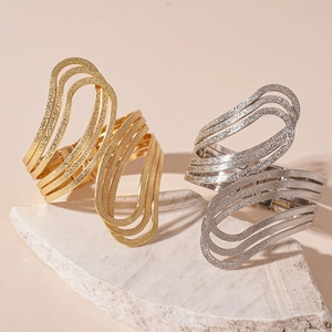 Minimalist geometric multi-layer open bangle in gold and silver matte metallic finish