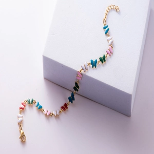 Gold titanium steel bracelet featuring colorful butterfly charms and adjustable chain