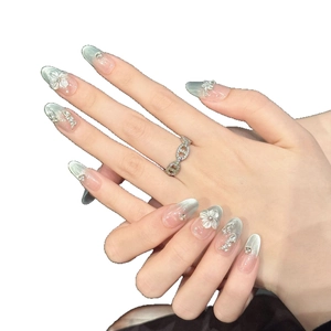 Handmade long stiletto press-on nails with blue-grey gradient and 3D floral relief motifs