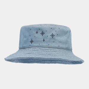 Detailed view of light blue denim bucket hat with black rhinestone star patterns