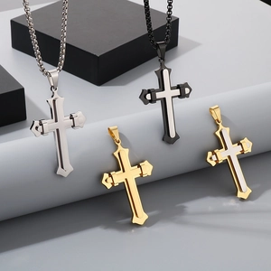 Detail showing various finishes of double-layered stainless steel cross pendants for men