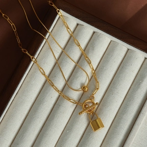 Double-layered gold titanium steel necklace with paperclip chain and padlock pendant