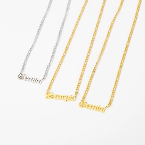 Three Figaro chains with Gothic zodiac name pendants in gold and silver finishes