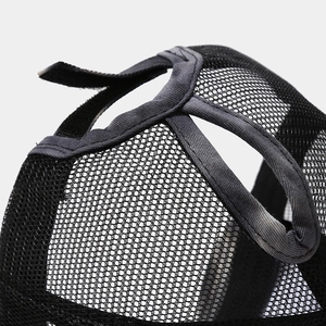 Detail of the black mesh baseball cap showing the criss-cross elastic ponytail hole design