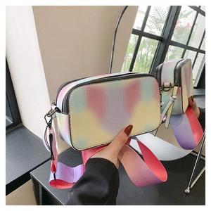 Detail of colorful gradient crossbody camera bag with dual zippers and wide strap