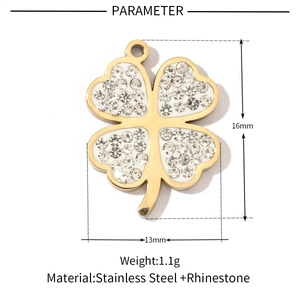 Detail view of gold clover pendant measuring 16mm by 13mm with rhinestone inlay