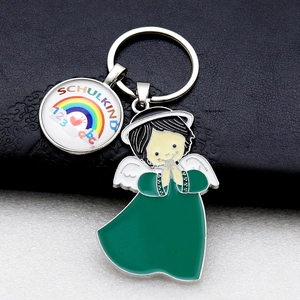 Detail of metal keychain with green angel pendant and Schulkind rainbow charm