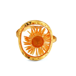 Hammered gold stainless steel ring featuring a preserved orange dried flower centerpiece