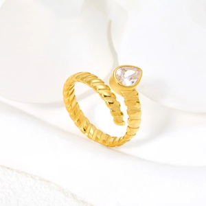 Gold spiral teardrop open ring in polished titanium steel with pear-shaped cubic zirconia