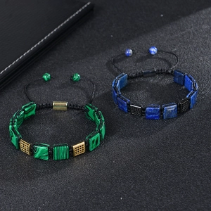 Detail of hand-woven malachite and lapis lazuli bracelets with gold-plated square beads