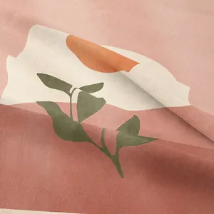 Tapisserie bohème avec imprimé soleil et feuilles dans les tons terre cuite et vert