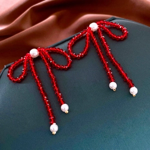 Vintage red crystal bow earrings with pearls and long tassel fringe in gold setting