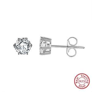 Detailed macro view of S925 sterling silver earrings with six-prong round 8mm cubic zirconia