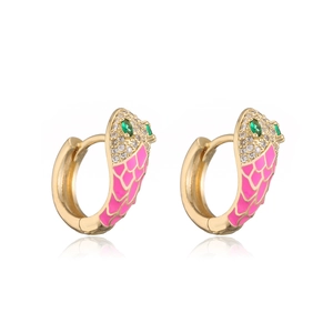 Close-up of gold snake earrings with pink enamel scales and green zircon eyes