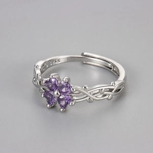 Detail of silver S925 ring showing purple zircon clover and vine texture details