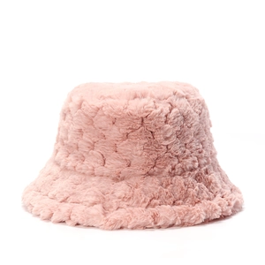 Detailed texture of thick pink plush faux fur bucket hat for winter outdoor warmth