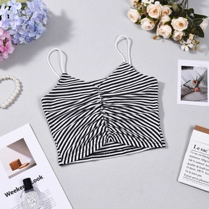 Detail shot of striped crop top with ruching and thin straps on a lifestyle background