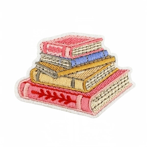 Stack of books embroidered patch with vibrant pink, yellow and blue threads on white background