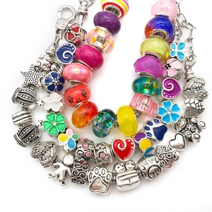 Detailed close-up of colorful DIY glass beads and enamel alloy charms for bracelets