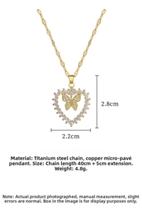 Detail showing gold titanium heart and butterfly pendant dimensions of 2.8cm by 2.2cm