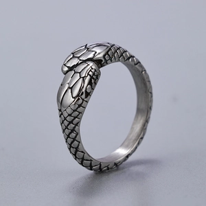 Vintage stainless steel snake head ring with detailed scales and retro finish