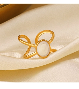Detail of a 18K gold plated oval enamel ring on a white silk background for women