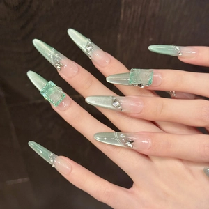 Mint green cat eye press-on nails with luxury square gems and butterfly accents