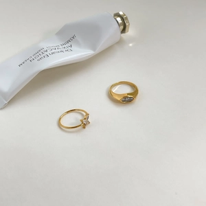 Elegant gold rings featuring a sparkling butterfly design and eye-shaped gemstone
