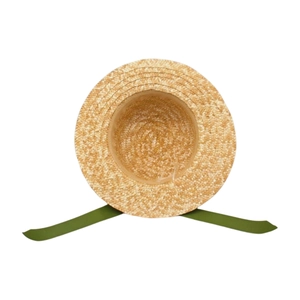 Close-up of woven straw sun hat texture with decorative olive green ribbons