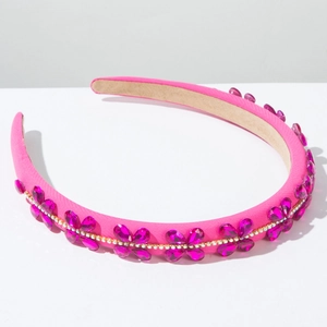 Detail of fuchsia baroque headband with crystal flower ornaments and rhinestone chain