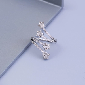Star-shaped zircon ring featuring a layered spiral design and polished silver finish
