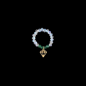 Close-up of iridescent beaded elastic ring featuring a golden geometric diamond pendant