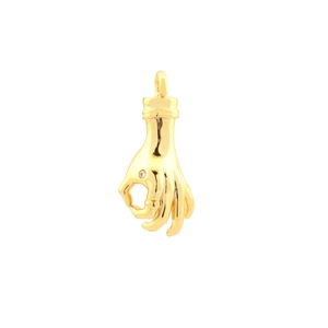 Macro view of gold plated OK hand gesture pendant with cubic zirconia inlay detail