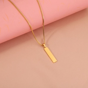 Macro shot of polished gold rectangular bar pendant on a sturdy box chain necklace