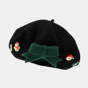 Detail of a Christmas beret with green felt bow and 3D Santa and snowman ornaments