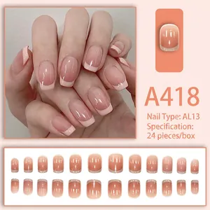 Detail of French gradient press-on nails in nude pink and white with 24-piece full set