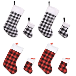 8-piece set of red and black buffalo plaid Christmas stockings in assorted sizes