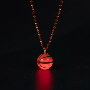 Glow-in-the-dark orange basketball pendant necklace featuring a luminous beaded chain detail