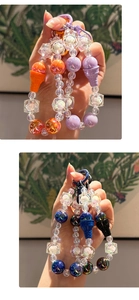 Macro detail of handmade beaded keychain featuring acrylic beads and ice cream pendant