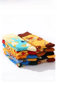 Detail of colorful mid-calf socks with food patterns like pasta and lemon designs